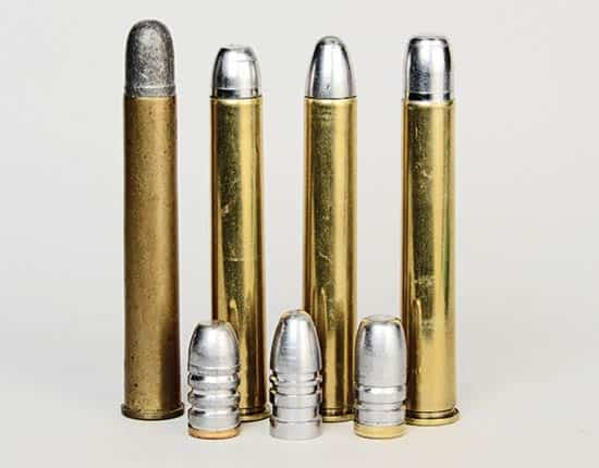At left is a factory-loaded .40-72 Winchester cartridge. 
