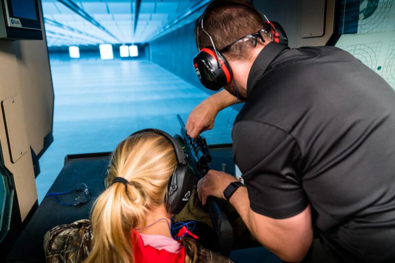 young girl seated at shooting bench during Vortex Hunter Sight-In Event
